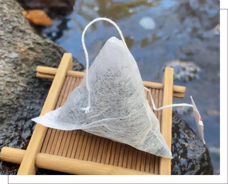 Tea bag on a bamboo board next to a river
